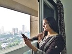 Mumbai, India - Oct. 18, 2025:Fiza Shaikh looks through window at newly alloted flats to Worli BDD chawl rsident, at worli in Mumbai, India, on Saturday, October 18, 2025. (Photo by Anshuman Poyrekar/Hindustan Times) (Anshuman Poyrekar/HT Photo)