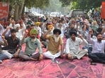 PSPCL employees protesting against the Optimum Use of Vacant Government Lands scheme outside the chief engineer's office in Ludhiana on Wednesday. (Manish/HT) PSPCL employees protesting against the Optimum Use of Vacant Government Lands scheme outside the chief engineer's office in Ludhiana on Wednesday. (Manish/HT)