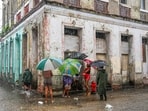  Residents wait in the streets for food hours before Hurricane Melissa hits the city of Santiago de Cuba, Cuba, on October 28, 2025.