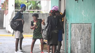 Homeless persons gather to get a hot meal at a Missionaries of the Poor location in Kingston on October 27, 2025. (AFP) Homeless persons gather to get a hot meal at a Missionaries of the Poor location in Kingston on October 27, 2025. (AFP)