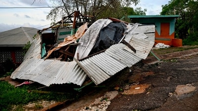 A store stands destroyed following the passage of Hurricane Melissa in Manchester, Jamaica, on October 28, 2025. Hurricane Melissa ripped up trees and knocked out power after making landfall in Jamaica on October 28, 2025 as one of the most powerful hurricanes on record, inundating the island nation with rains that threaten flash floods and landslides. (Photo by Ricardo Makyn / AFP) (AFP) A store stands destroyed following the passage of Hurricane Melissa in Manchester, Jamaica, on October 28, 2025. Hurricane Melissa ripped up trees and knocked out power after making landfall in Jamaica on October 28, 2025 as one of the most powerful hurricanes on record, inundating the island nation with rains that threaten flash floods and landslides. (Photo by Ricardo Makyn / AFP) (AFP)