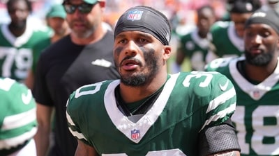 Former New York Jets cornerback Michael Carter II (30) goes to the locker room at halftime vs Tampa (AP) Former New York Jets cornerback Michael Carter II (30) goes to the locker room at halftime vs Tampa (AP)