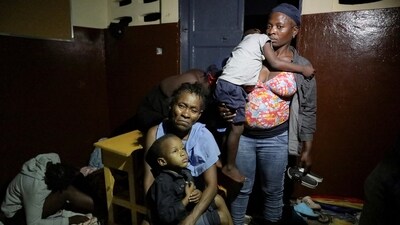 People gather at a school turned shelter while Haiti is seeing downpours from the outer bands of Hurricane Melissa, as the storm is churning towards Cuba, after making landfall in Jamaica, in Les Cayes, Haiti, October 28, 2025. REUTERS/Patrice Noel (REUTERS)