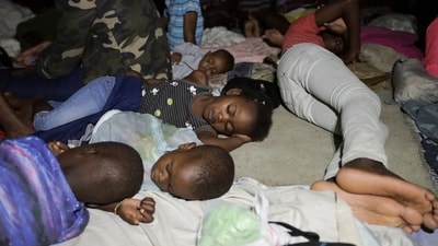 People sleep at a school turned shelter while Haiti is seeing downpours from the outer bands of Hurricane Melissa, as the storm is churning towards Cuba, after making landfall in Jamaica, in Les Cayes, Haiti, October 28, 2025. REUTERS/Patrice Noel (REUTERS)