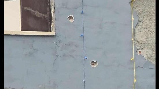 Bullet marks on the building where the miscreants had opened fire in Karnal on Wednesday. (HT Photo)