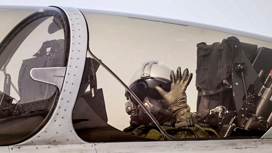 President Droupadi Murmu waves her hand at the camera as she takes a sortie in Rafale fighter jet, at Air Force Station in Haryana's Ambala today. The President's sortie in a Rafale jet gains significance against the backdrop of the aircraft's use during Operation Sindoor, the Indian armed forces' operation launched against terror infrastructure in response to the April 22 terrorist attack in Jammu and Kashmir's Pahalgam.(Rashtrapati Bhavan/PTI)