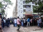 People gather outside the RA studio at Powai, where a man, identified as Rohit Arya, held several children hostage. He was later shot during the rescue operation, in Mumbai on Thursday.