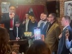 Alternative for Germany (AfD)'s Jan Wenzel Schmidt (R), member of Germany's lower house of parliament Bundestag and AfD's Christian von Hoffmeister sing "Germany, Germany above all", the tabooed verse of the German national anthem, together with singer Emilio Pons and Stefano Forte (3rd R), president of the New York Young Republican Club, at a gathering, in a Manhattan club in New York City, U.S.