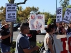 Protesters hold signs during an ”ICE Out of OC” rally at Home Depot in Garden Grove, California, on August 19, 2025. (Getty Images) Protesters hold signs during an ”ICE Out of OC” rally at Home Depot in Garden Grove, California, on August 19, 2025. (Getty Images)