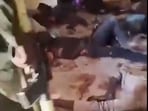 This frame grab from footage shared on social media by Mini Minawi, the governor of Sudan's Darfur region, appears to show RSF fighters walking among bodies lying motionless on the floor inside the Saudi Maternity Hospital in El-Fasher, Darfur region, Sudan. This frame grab from footage shared on social media by Mini Minawi, the governor of Sudan's Darfur region, appears to show RSF fighters walking among bodies lying motionless on the floor inside the Saudi Maternity Hospital in El-Fasher, Darfur region, Sudan.