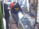 The robbery captured on a CCTV camera installed inside the shop in Jalandhar’s Bhargav Camp area. (Sourced) The robbery captured on a CCTV camera installed inside the shop in Jalandhar’s Bhargav Camp area. (Sourced)