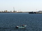 A speed boat passes by oil docks at the port of Kalantari in the city of Chabahar, east of the Strait of Hormuz. 