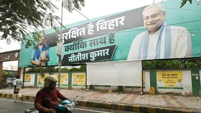 A hoarding of Bihar chief minister Nitish Kumar put up near the JD(U )office in Patna. (Santosh Kumar/ HT Photo)