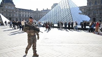 A soldier patrols in courtyard of the Louvre museum, Thursday, Oct. 30, 2025 in Paris. (AP) A soldier patrols in courtyard of the Louvre museum, Thursday, Oct. 30, 2025 in Paris. (AP)
