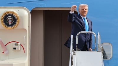 US President Donald Trump boards Air Force One after the APEC Summit. (AP) US President Donald Trump boards Air Force One after the APEC Summit. (AP)