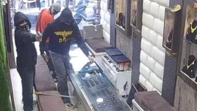 The robbery captured on a CCTV camera installed inside the shop in Jalandhar’s Bhargav Camp area. (Sourced)