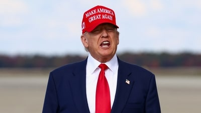 US President Donald Trump speaks, while wearing a "Make America Great Again" cap. (REUTERS)