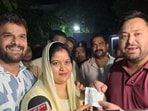 Singer and actor Khesari Lal Yadav, right, and his wife Chanda, with Tejashwi Yadav in Patna, Bihar,after he joined RJD. 