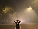 A person covers his face with a hankerchief amid air pollution on Tilak Marg near the Supreme Court in New Delhi on Tuesday early morning. (Arvind Yadav/HT) A person covers his face with a hankerchief amid air pollution on Tilak Marg near the Supreme Court in New Delhi on Tuesday early morning. (Arvind Yadav/HT)