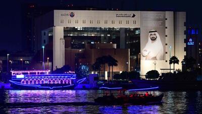 Boats decorated with luminous garlands sail past a portrait of Dubai's ruler Sheikh Mohammed bin Rashid Al-Maktoum hung on the Gulf Emirate's municipality building, during celebrations on the first day of Diwali, on October 17 (AFP FILE) Boats decorated with luminous garlands sail past a portrait of Dubai's ruler Sheikh Mohammed bin Rashid Al-Maktoum hung on the Gulf Emirate's municipality building, during celebrations on the first day of Diwali, on October 17 (AFP FILE)