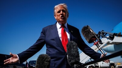 US President Donald Trump speaks to reporters as he arrives at Palm Beach International Airport on October 31, 2025 (Getty Images via AFP) US President Donald Trump speaks to reporters as he arrives at Palm Beach International Airport on October 31, 2025 (Getty Images via AFP)