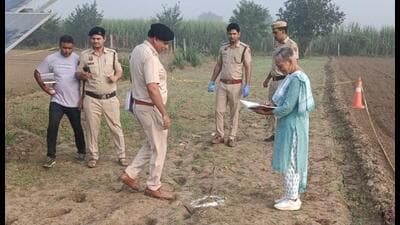 Forensic experts at the encounter spot near the Jassia-Dhamar road in Rohtak district on Friday morning. (HT Photo) Forensic experts at the encounter spot near the Jassia-Dhamar road in Rohtak district on Friday morning. (HT Photo)