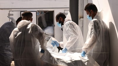 Employees of the Nasser Medical Complex move body bags of the thirty bodies of Palestinian prisoners detained by Israel and released as part of the hostage exchange deal. (AFP) Employees of the Nasser Medical Complex move body bags of the thirty bodies of Palestinian prisoners detained by Israel and released as part of the hostage exchange deal. (AFP)