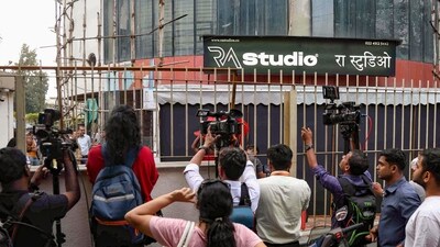 Media representatives at the site where 17 children were rescued from a studio in Powai area while the man who had held them hostage succumbed to bullet injuries sustained during the operation, in Mumbai, Thursday. (PTI) Media representatives at the site where 17 children were rescued from a studio in Powai area while the man who had held them hostage succumbed to bullet injuries sustained during the operation, in Mumbai, Thursday. (PTI)