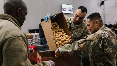 Members of the California National Guard sort donated food items at Los Angeles Regional Food Bank's South Los Angeles warehouse (Bloomberg)