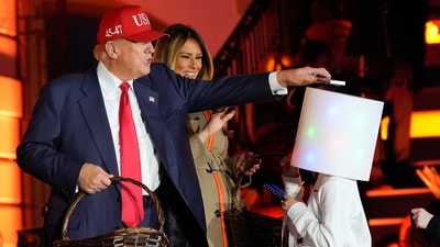 Trump recreated a viral 2019 Halloween moment by placing a chocolate bar on the head of a child dressed as DJ Marshmello. The stunt echoed his previous 2019 trick when he famously balanced a chocolate bar on the head of a child dressed as a Minion from Despicable Me. (AP Photo/Alex Brandon) (AP) Trump recreated a viral 2019 Halloween moment by placing a chocolate bar on the head of a child dressed as DJ Marshmello. The stunt echoed his previous 2019 trick when he famously balanced a chocolate bar on the head of a child dressed as a Minion from Despicable Me. (AP Photo/Alex Brandon) (AP)