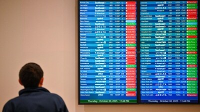 Cancelled flights are seen on a screen at Orlando International Airport in Orlando, Florida on October 30. (AFP)
