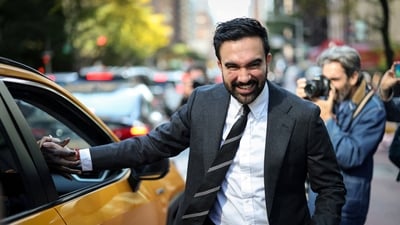 Democratic candidate for New York City Mayor, Zohran Mamdani, shakes the hand of a cab driver while campaigning in Manhattan's Upper East Side neighborhood during early voting, in New York City, on October 27, 2025. (Mike Segar/Reuters)