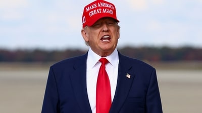 US President Donald Trump speaks, while wearing a "Make America Great Again" cap. (REUTERS)