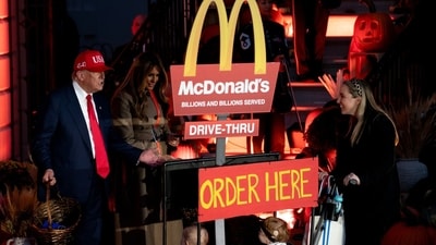 Trump and Melania greet children dressed as McDonald's drive-thru during the Halloween event. Photographer: Stefani Reynolds/Bloomberg (Bloomberg) Trump and Melania greet children dressed as McDonald's drive-thru during the Halloween event. Photographer: Stefani Reynolds/Bloomberg (Bloomberg)