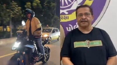 In of the videos, Talsania is seen standing while riding a two-wheeler. (X/ @PoliceAhmedabad) In of the videos, Talsania is seen standing while riding a two-wheeler. (X/ @PoliceAhmedabad)