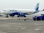(FILES) Ground staff walk past an Indigo airlines aircraft taxiing in the apron at the Netaji Subhash Chandra Bose International airport in Kolkata on February 1, 2024. India and China resume direct flights on October 26 after a five-year suspension, a move important both for trade and a symbolic step as Asia's giants cautiously rebuild relations. (Photo by Indranil MUKHERJEE / AFP) (FILES) Ground staff walk past an Indigo airlines aircraft taxiing in the apron at the Netaji Subhash Chandra Bose International airport in Kolkata on February 1, 2024. India and China resume direct flights on October 26 after a five-year suspension, a move important both for trade and a symbolic step as Asia's giants cautiously rebuild relations. (Photo by Indranil MUKHERJEE / AFP)