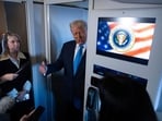 File photo of President Donald Trump speaking to reporters as Press Secretary Karoline Leavitt, left, listens. File photo of President Donald Trump speaking to reporters as Press Secretary Karoline Leavitt, left, listens.