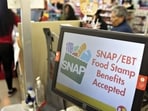 SNAP/EBT Food Stamp Benefits Accepted" is displayed on a screen inside a Family Dollar store in Chicago, Illinois, on March 3, 2020