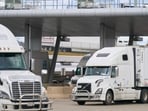 Commercial trucks cross into Canada from the US. Commercial trucks cross into Canada from the US.