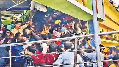 A videograb of the incident, which occurred as devotees were climbing a narrow staircase leading to the first floor of Sri Venkateswara Swamy temple, at Kasibugga in Srikakulam on Saturday. (HT PHOTO) A videograb of the incident, which occurred as devotees were climbing a narrow staircase leading to the first floor of Sri Venkateswara Swamy temple, at Kasibugga in Srikakulam on Saturday. (HT PHOTO)