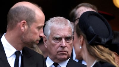 Former Prince Andrew stands next to Prince William and his wife Catherine, Princess of Wales, as they leave Westminster Cathedral (REUTERS)