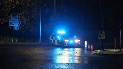 Police work at the Huntingdon, England, train station in Cambridgeshire, after people were stabbed on a train. (AP) Police work at the Huntingdon, England, train station in Cambridgeshire, after people were stabbed on a train. (AP)