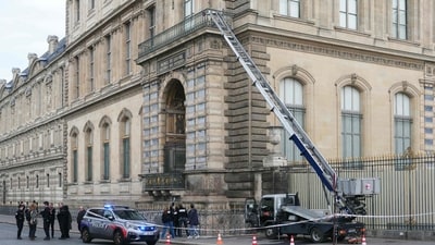 French police officers patrol in front of the Louvre Museum after it was robbed, with the Louvre Pyramid designed by Ieoh Ming Pei in the background. (AFP) French police officers patrol in front of the Louvre Museum after it was robbed, with the Louvre Pyramid designed by Ieoh Ming Pei in the background. (AFP)