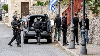 Special police units operate following an incident where two people were killed and at least 10 injured in a shooting in a village, in what a senior police official described as a family vendetta, in Vorizia village, Crete island, Greece. (Reuters)