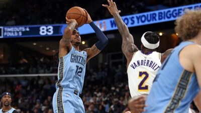 Memphis Grizzlies guard Ja Morant (12) shoots as Los Angeles Lakers forward Jarred Vanderbilt (2) defends (IMAGN IMAGES via Reuters Connect)