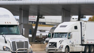 Commercial trucks cross into Canada from the US. (AFP)