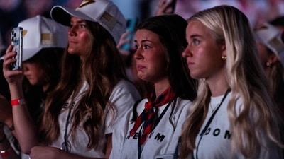 An attendee tears up listening to Erika Kirk speak at the Pavilion at Ole Miss on the campus of the University of Mississippi on October 29, 2025 in Oxford, Mississippi.&nbsp; (Getty Images via AFP)