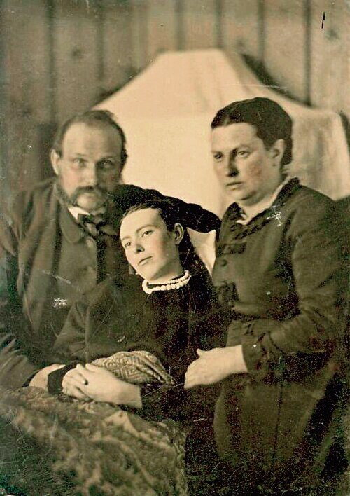 A Victorian-era death portrait (the girl in the centre is deceased). (Wikimedia) A Victorian-era death portrait (the girl in the centre is deceased). (Wikimedia)