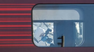 After the train was stopped, armed officers boarded it as police cars, a fleet of ambulances and two air ambulances swarmed the station in the market town. (REUTER)