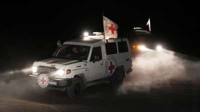 Red Cross vehicles seen carrying the bodies of three people believed to be deceased hostages handed over by Hamas (AP) Red Cross vehicles seen carrying the bodies of three people believed to be deceased hostages handed over by Hamas (AP)